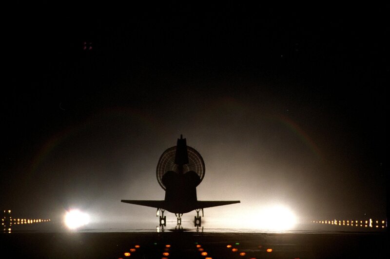 Space Shuttle on Runway — Black, Dramatic