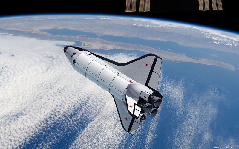 space shuttle orbiting earth