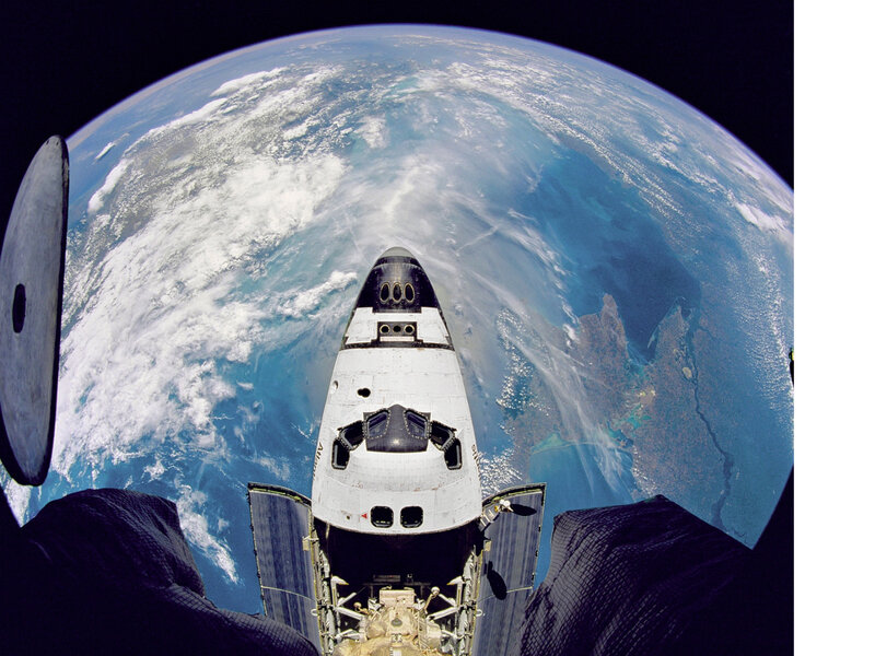 Space shuttle over Earth