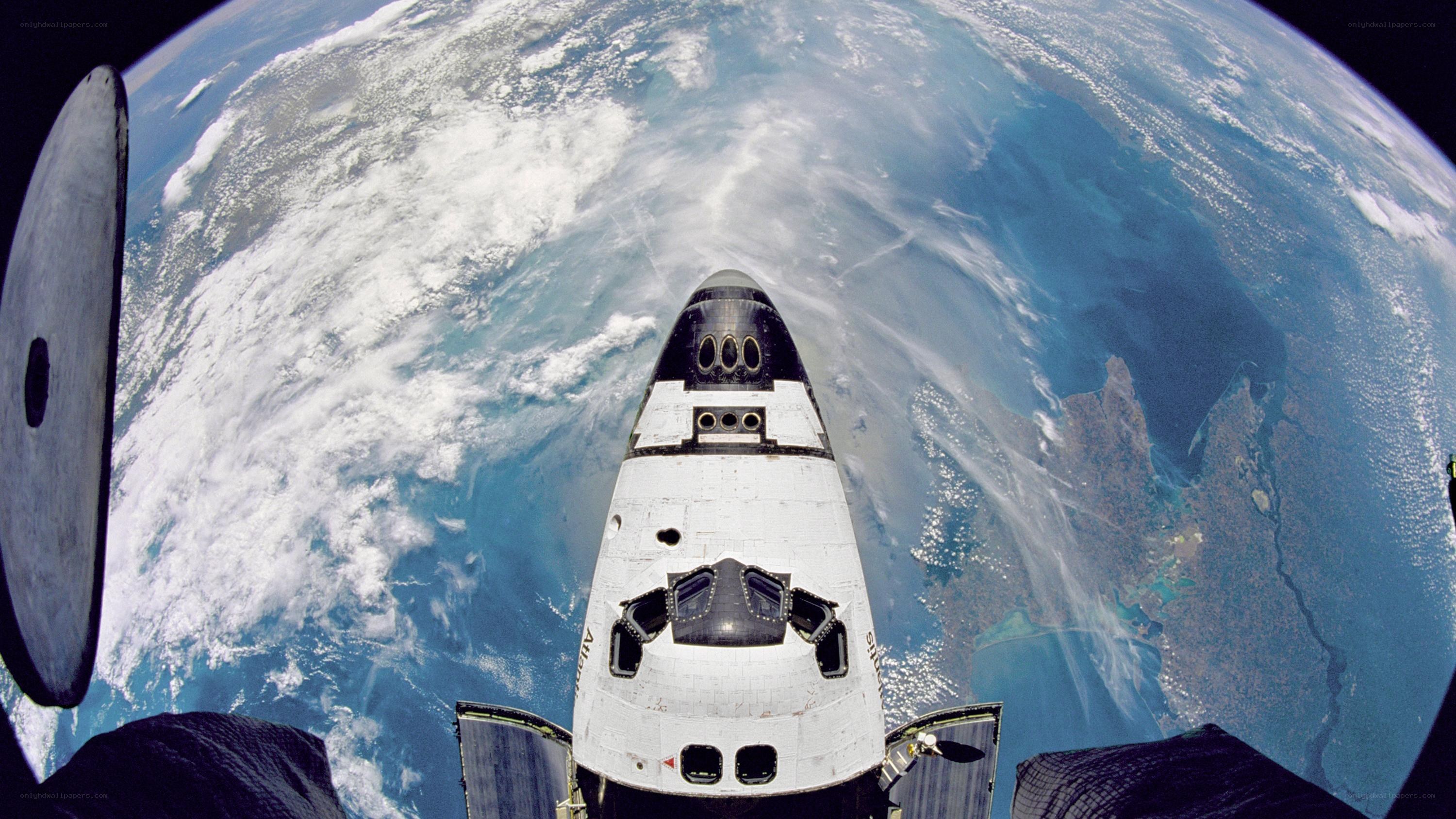 Space shuttle over Earth
