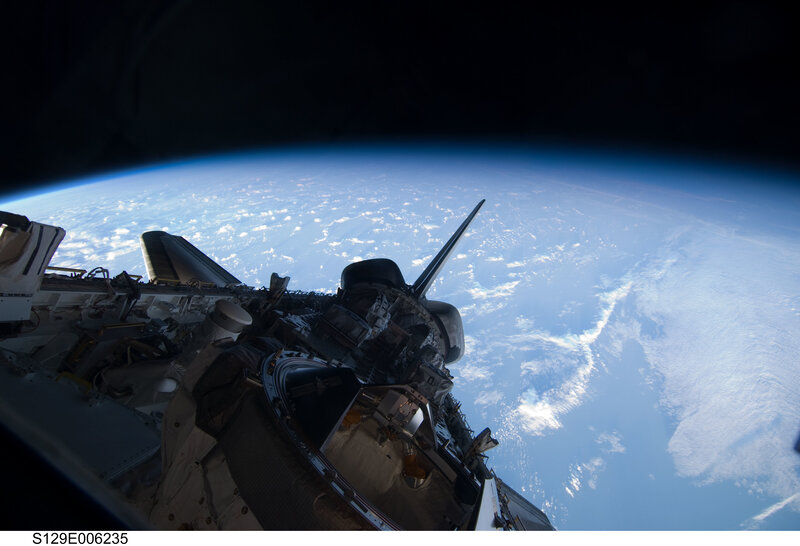 Space shuttle over Earth