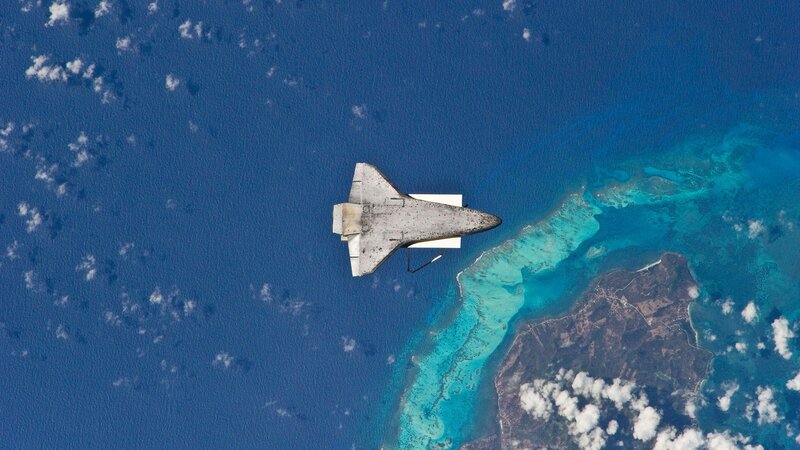 Space shuttle over ocean