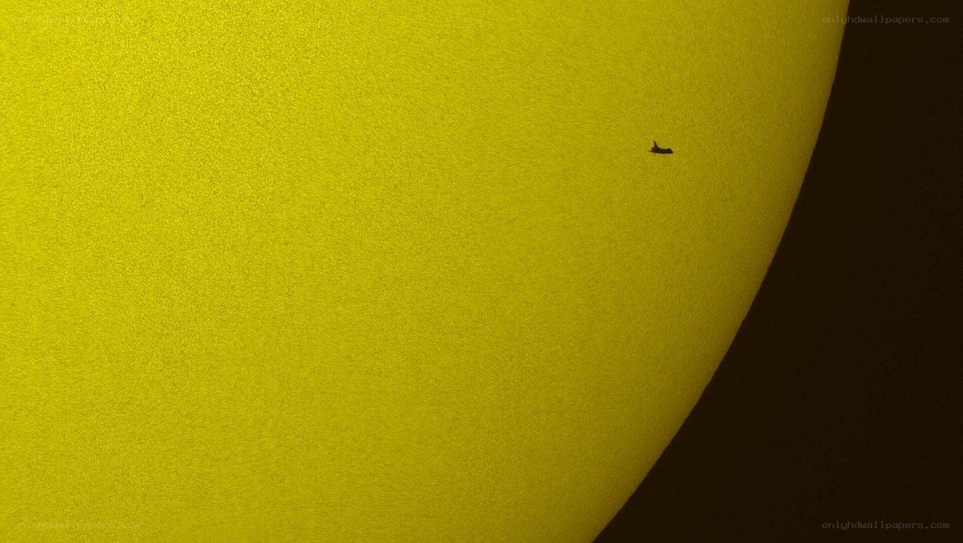 Space shuttle transiting the sun