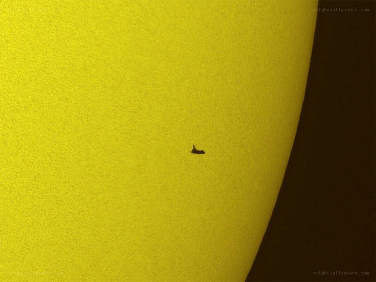 Space shuttle transiting the sun