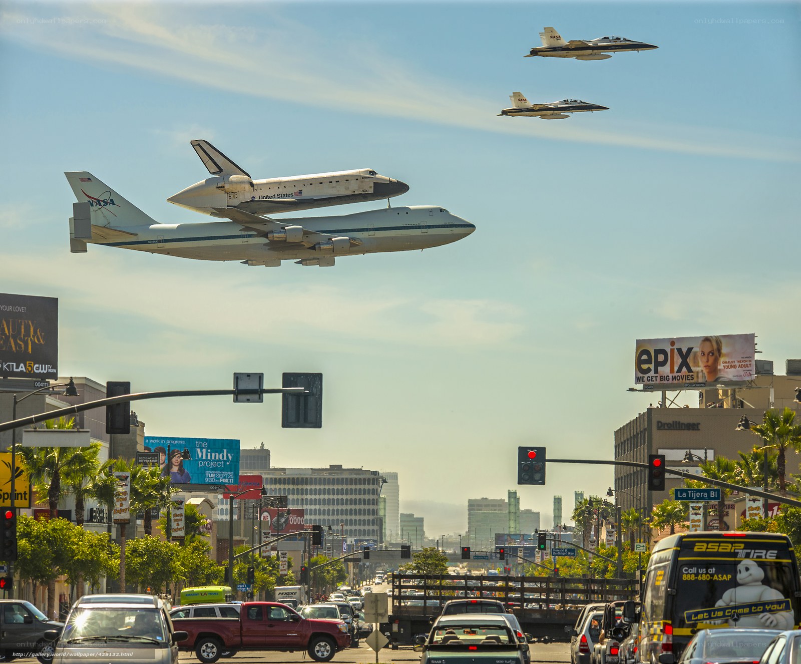 Space shuttle transport over city