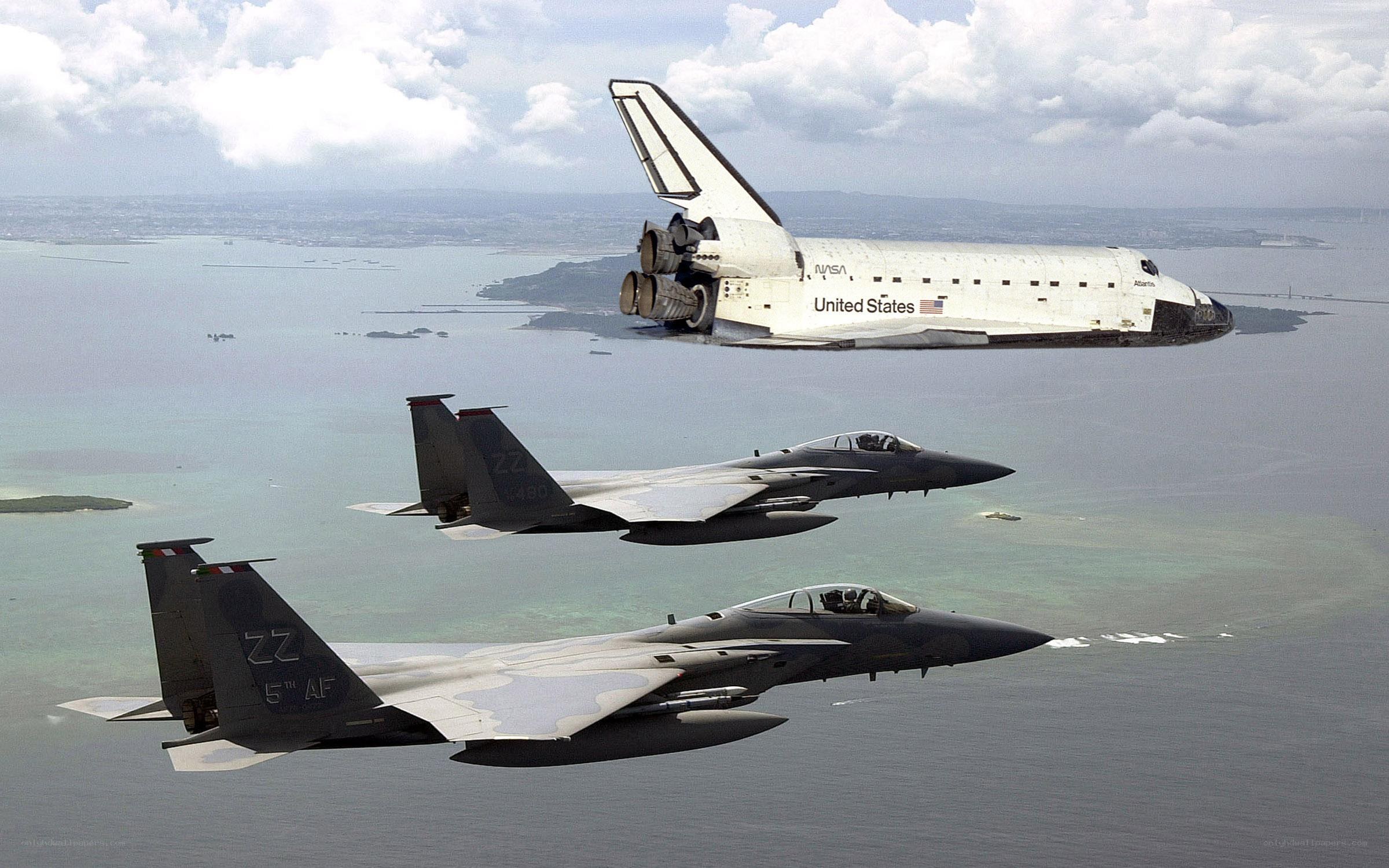 Space shuttle with fighter jets
