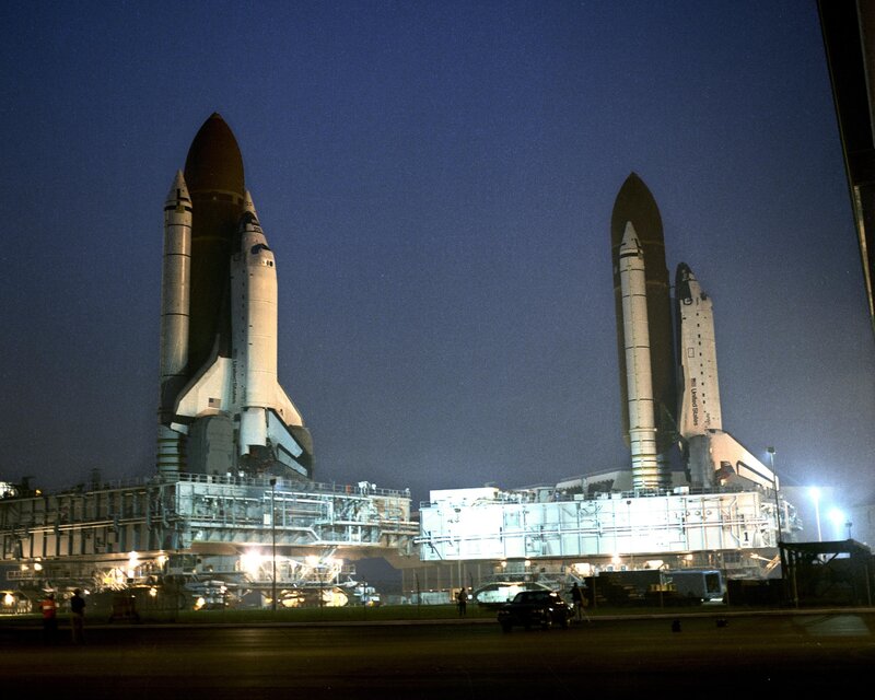 Space shuttles on launch pads