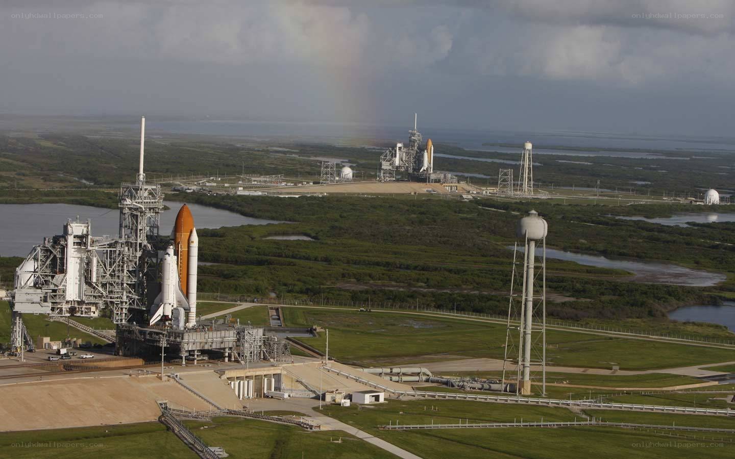 Space shuttles on launch pads