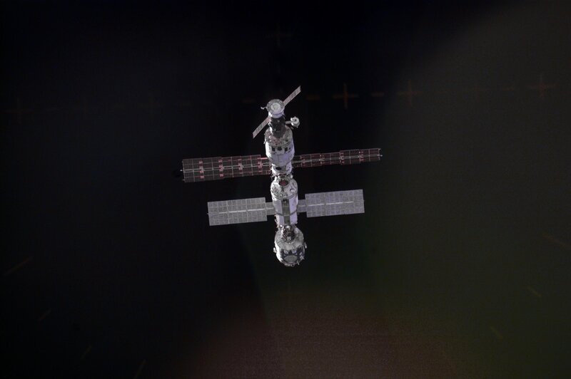 Space Station in Orbit — Black, Dramatic, Night, Photograph, Solar Panels, Earth