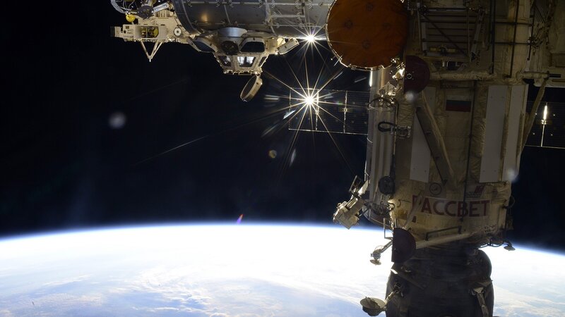 Space Station Orbiting Earth — Black, Dramatic, Photograph