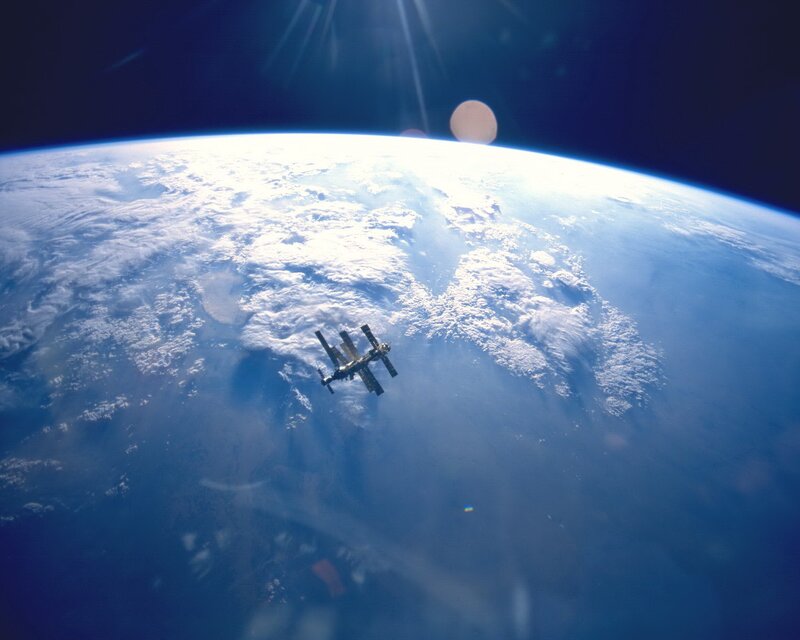 Space Station Orbiting Earth — Blue, Dramatic, Photograph, Clouds, Sun, White, Black