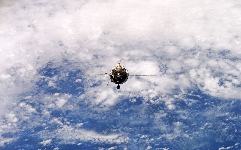 Spacecraft Above Clouds — Blue
