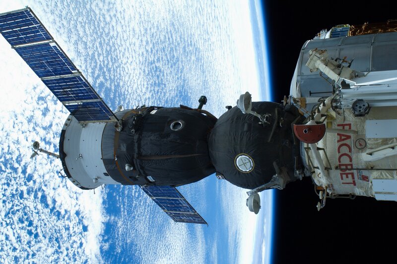 Spacecraft Docking with Station — Blue, Dramatic, Photograph, Solar Panels