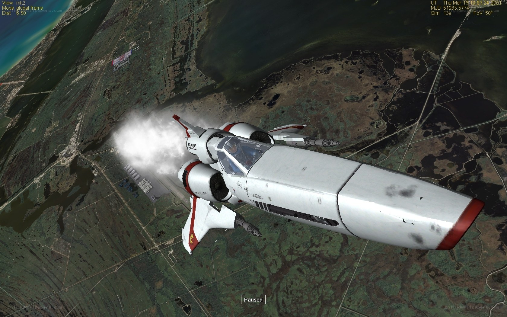 spacecraft in flight over terrain