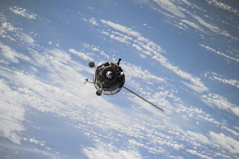 Spacecraft in Orbit — Blue, Serene, Photograph, Earth, Clouds, Satellite