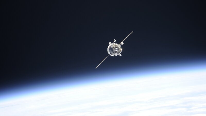 Spacecraft in Orbit — Blue, Serene, Photograph, Earth, Clouds
