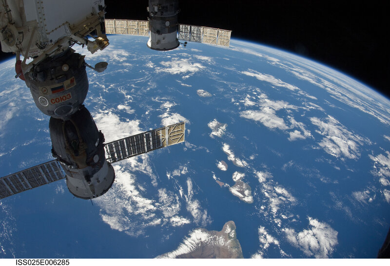 Spacecraft Orbiting Earth — Blue