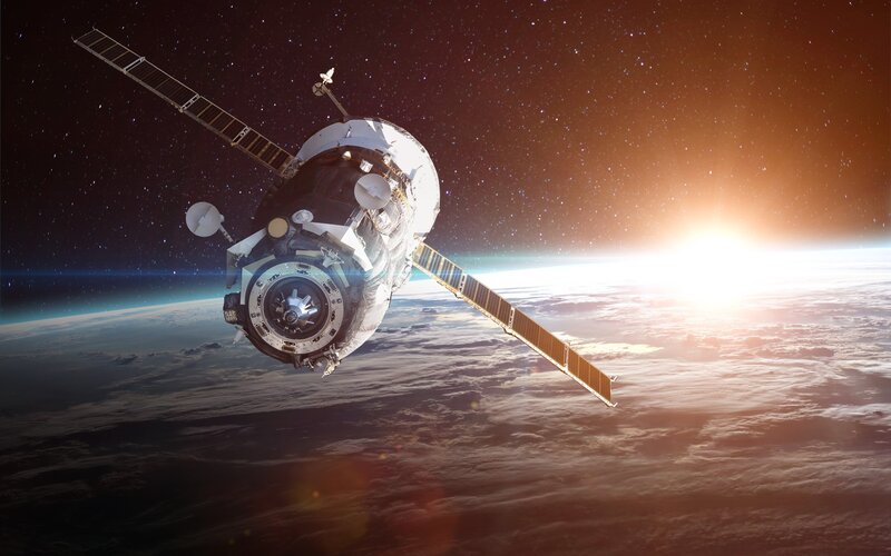 Spacecraft Orbiting Earth — White