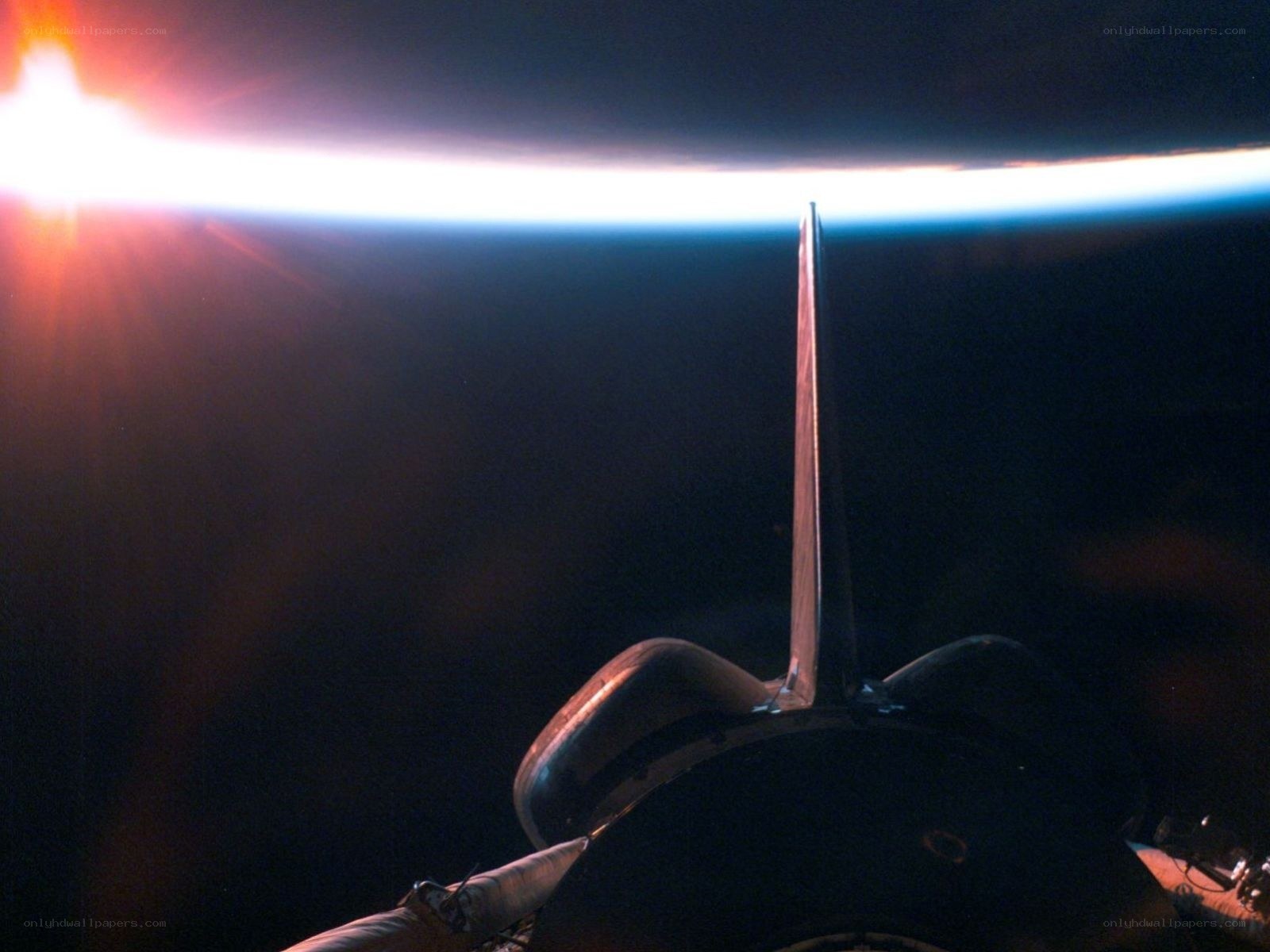 Spacecraft over Earth's horizon