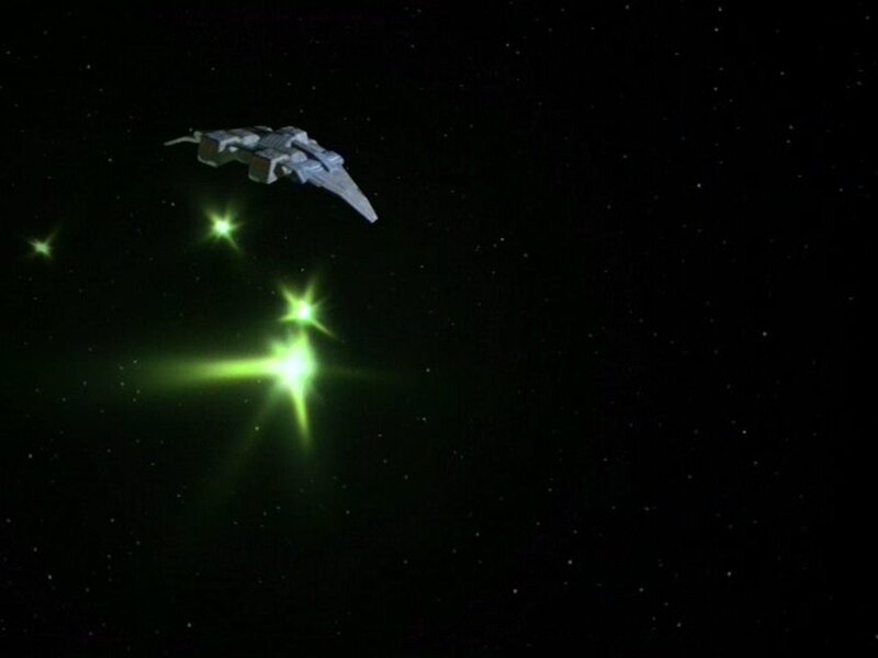 spaceship in space with green lights