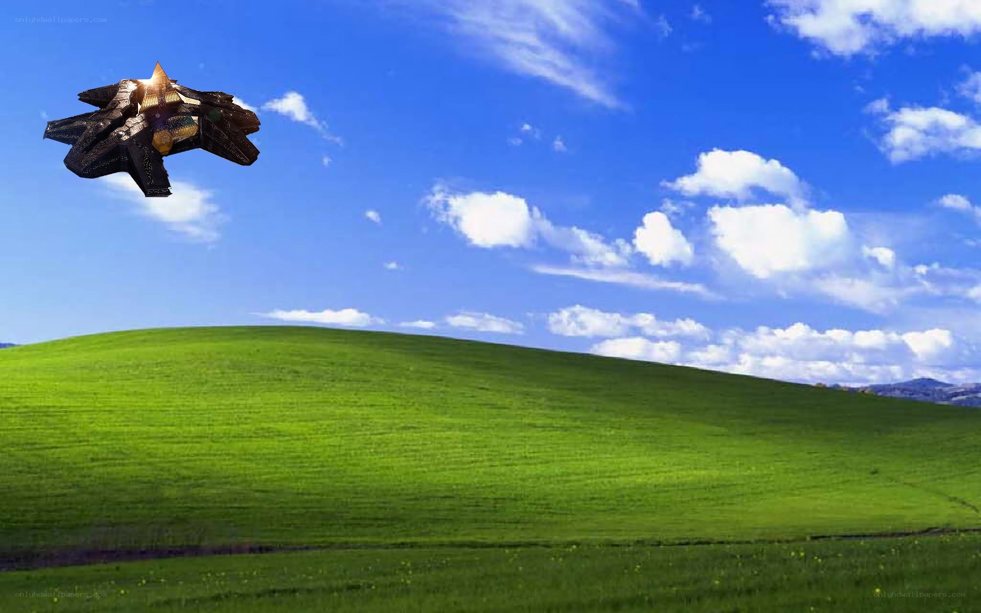 spaceship over green hills