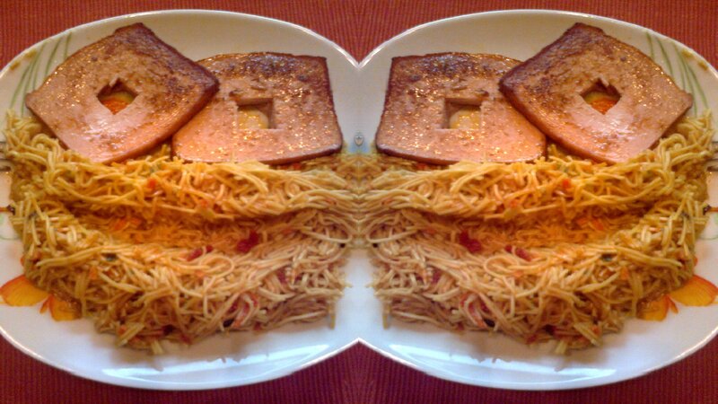 Spaghetti with ham on plates