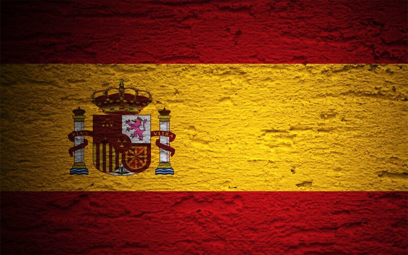 Spanish flag on textured wall