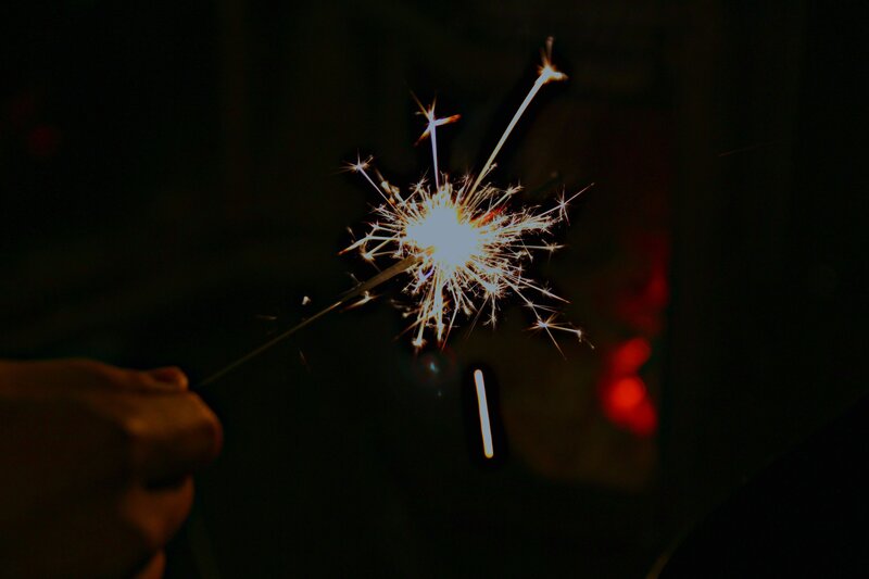 Sparkler in hand at night