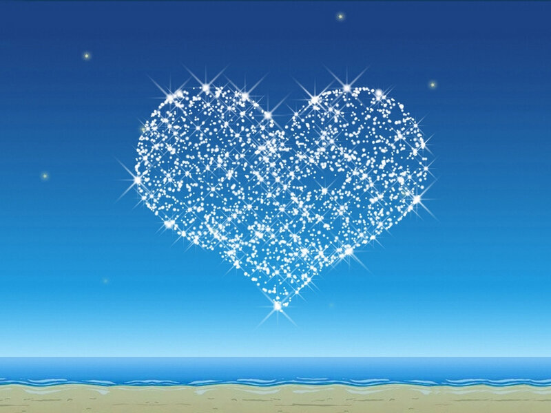 sparkling heart over beach