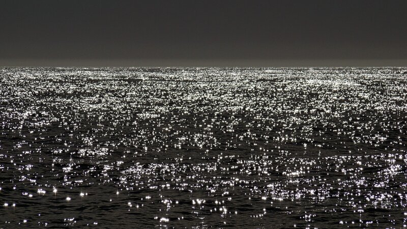 sparkling ocean at night