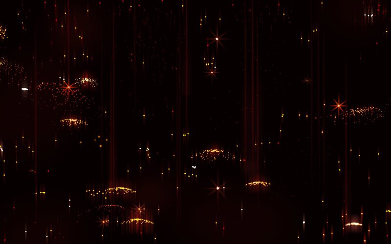 sparkling red particles falling
