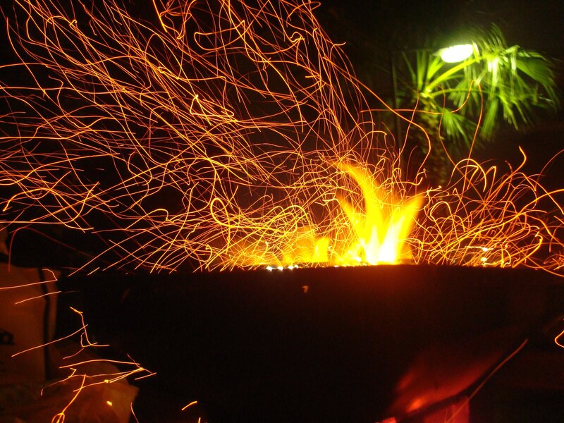 Sparks flying from a fire pit
