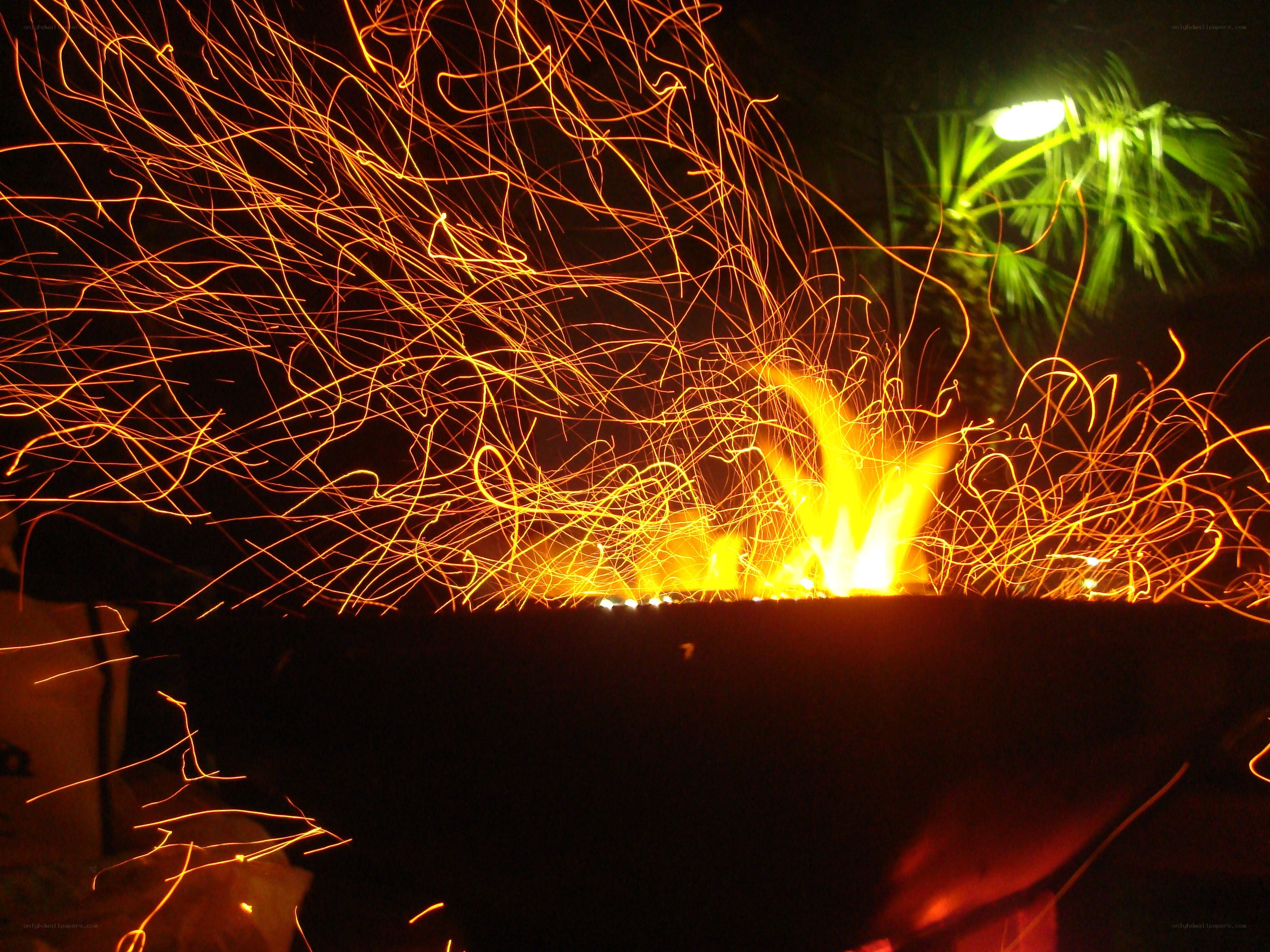 Sparks flying from a fire pit