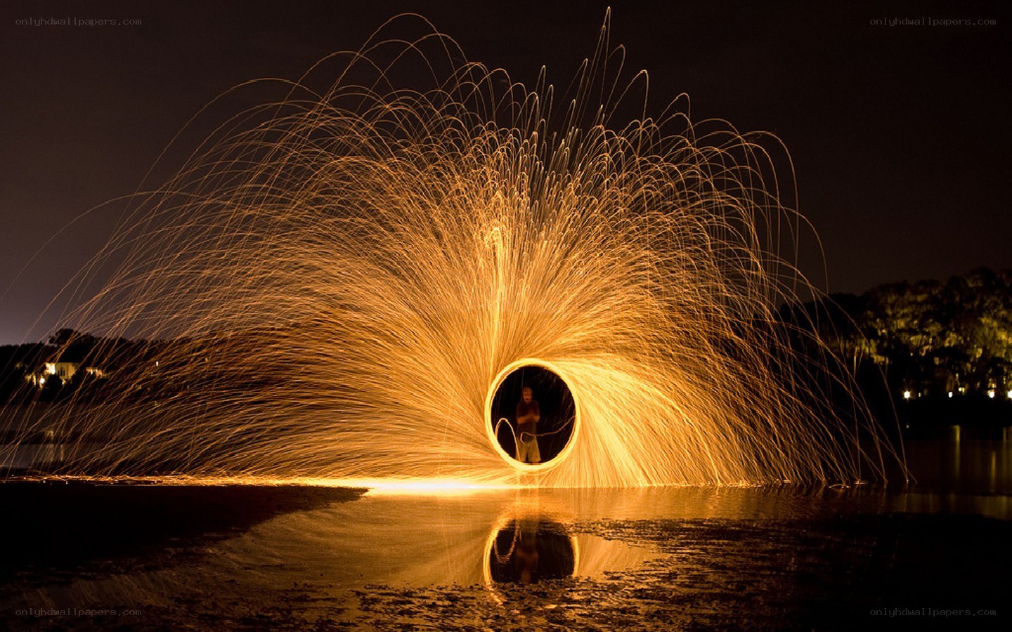 Sparks forming a ring over water