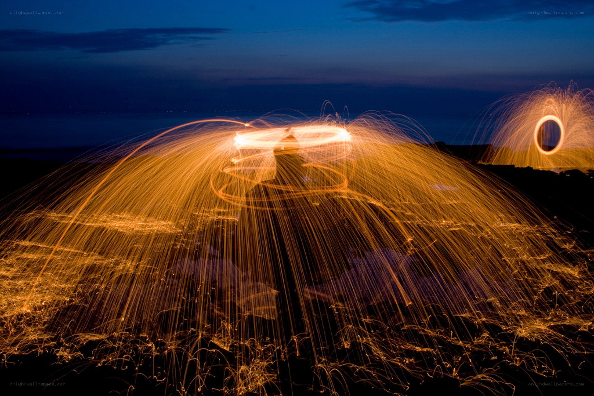 Sparks from steel wool at night