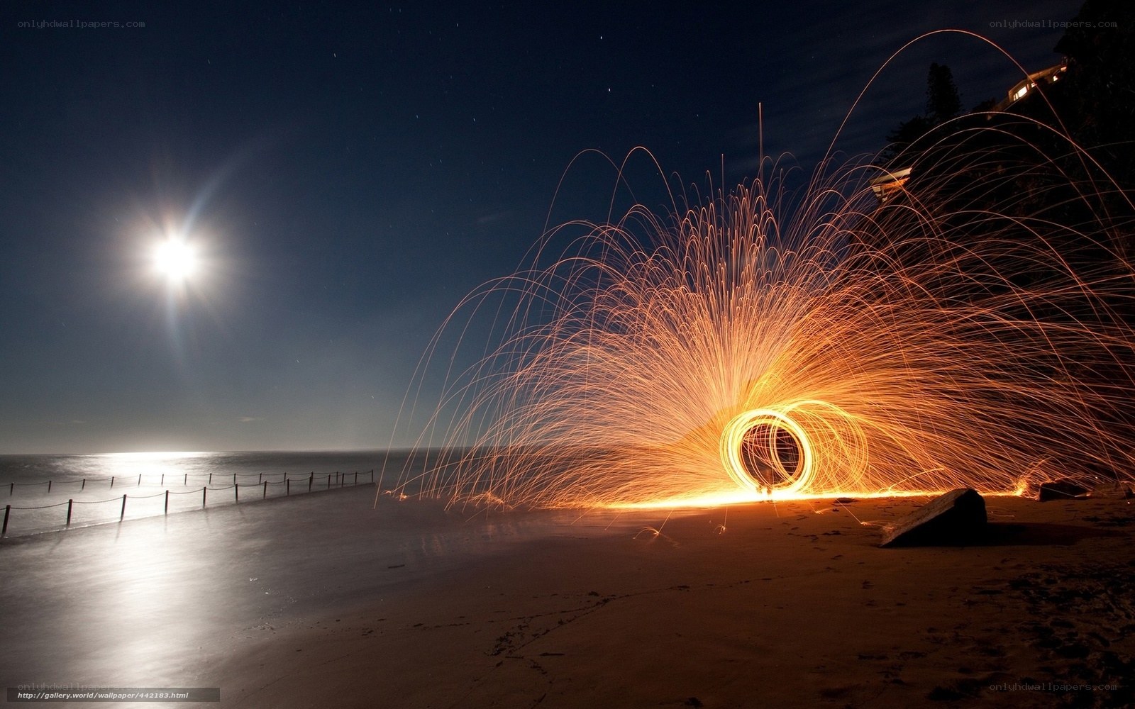 Sparks on the beach at night