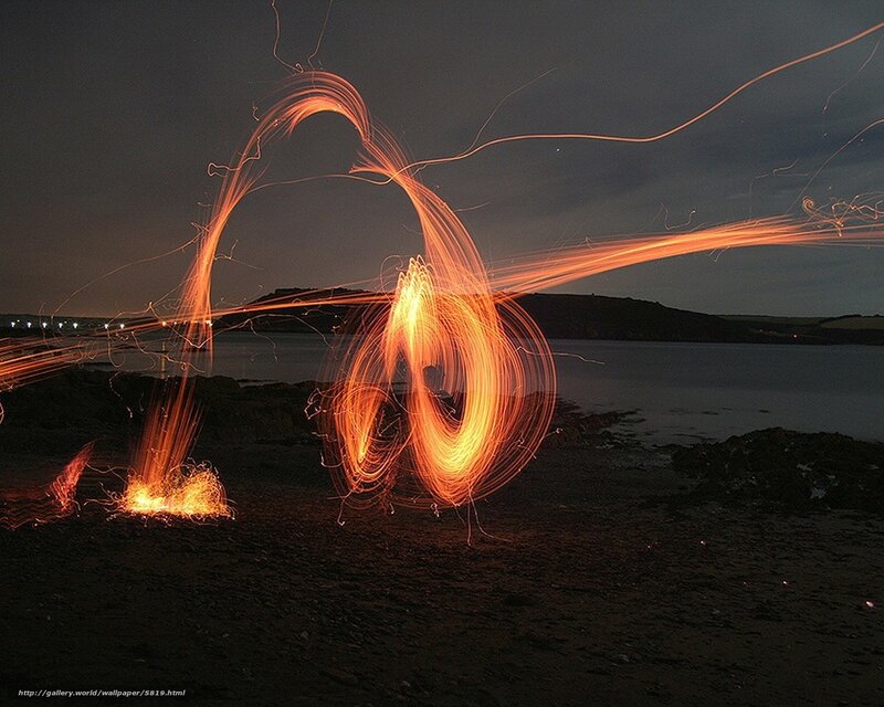Sparks on the beach at night