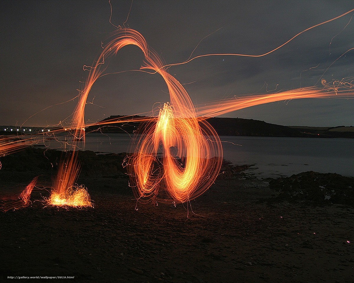 Sparks on the beach at night