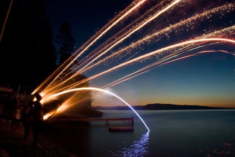 Sparks over the lake at dusk