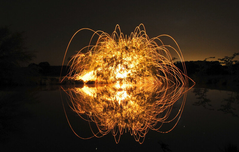 Sparks reflected in water