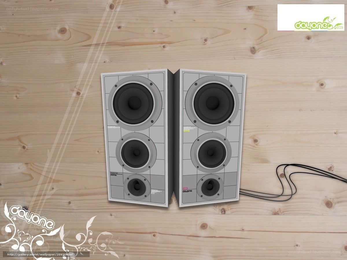 speakers on wooden surface