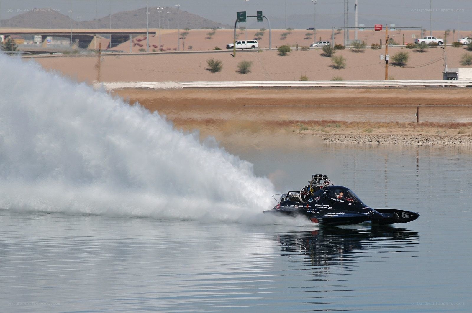 speed boat racing on water