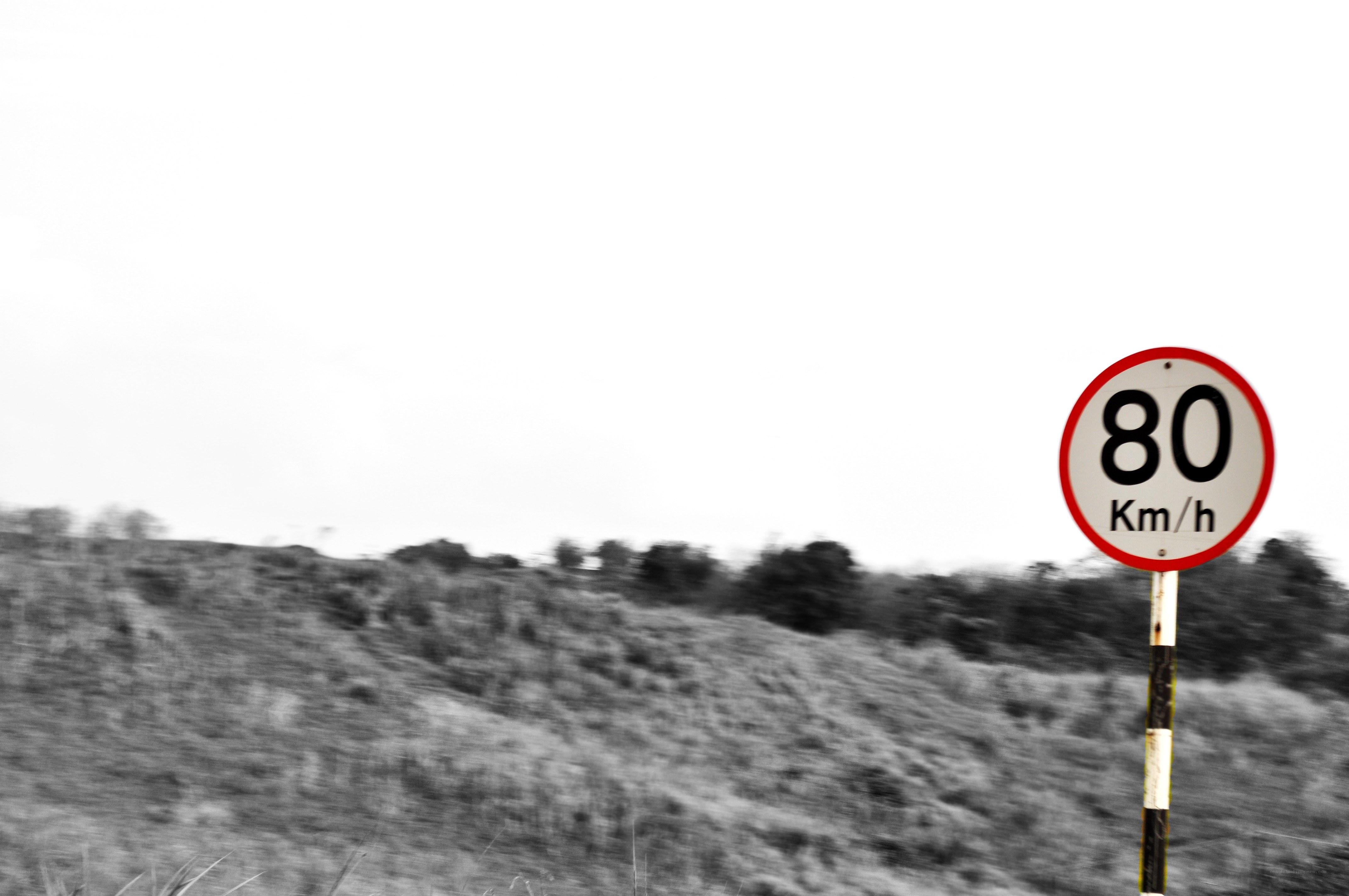 Speed limit sign on a hill