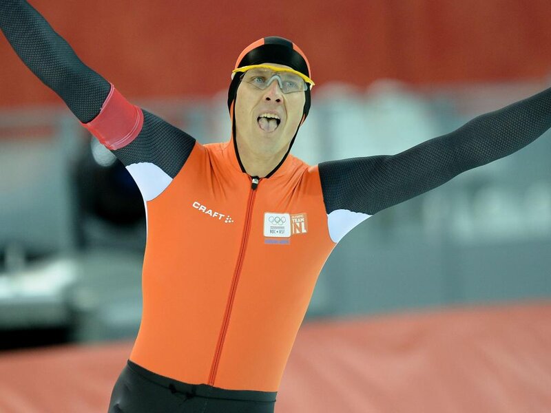 Speed Skater Celebrating — Orange, Celebratory, Photograph