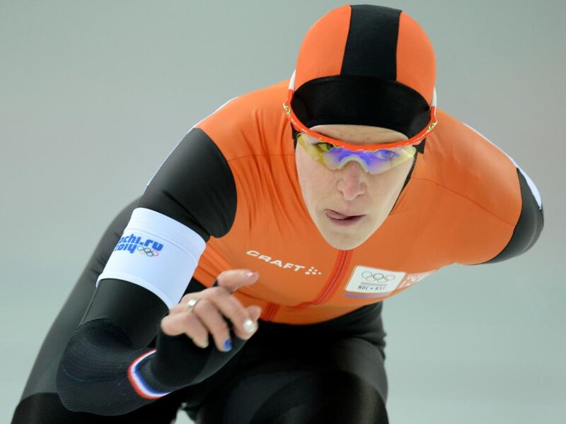 Speed Skater in Action — Orange, Focused, Photograph, Goggles, Helmet