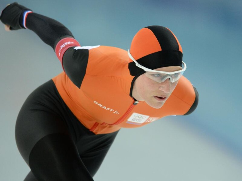 Speed Skater in Action — Orange, Focused, Photograph, Goggles, Orange Suit