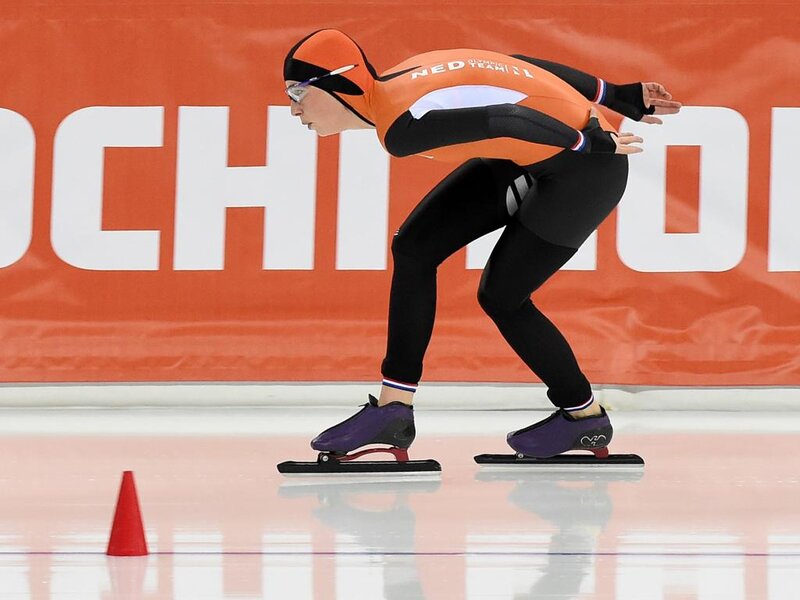 Speed Skater in Action — Orange, Focused, Photograph