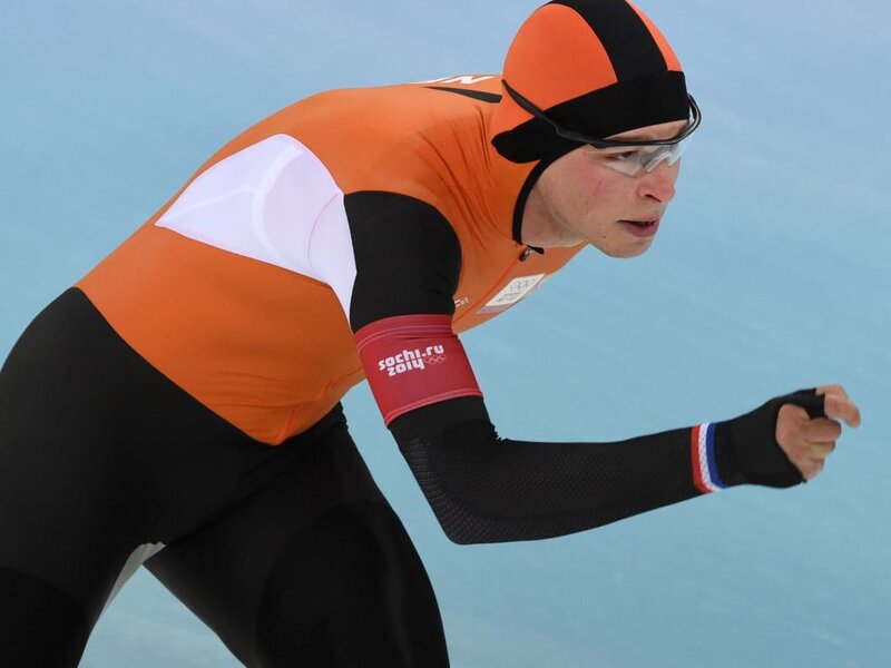 Speed Skater in Action — Orange, Focused