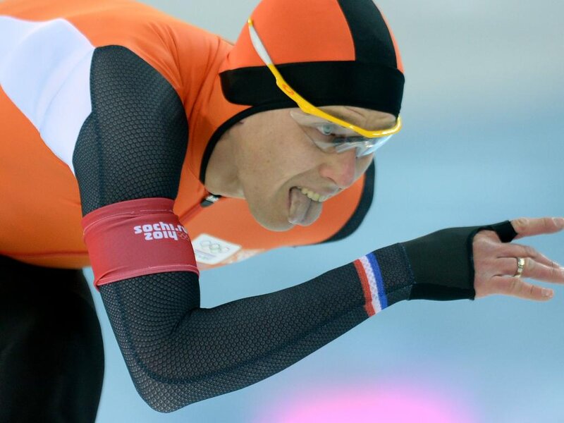 Speed Skater in Action — Orange, Intense, Photograph, Goggles, Helmet