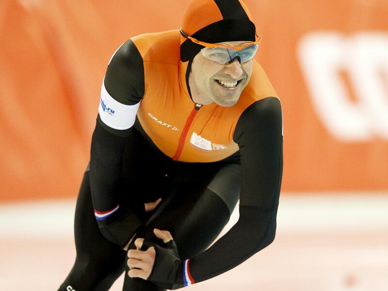 Speed Skater in Action — Orange, Intense, Photograph, Skating Suit
